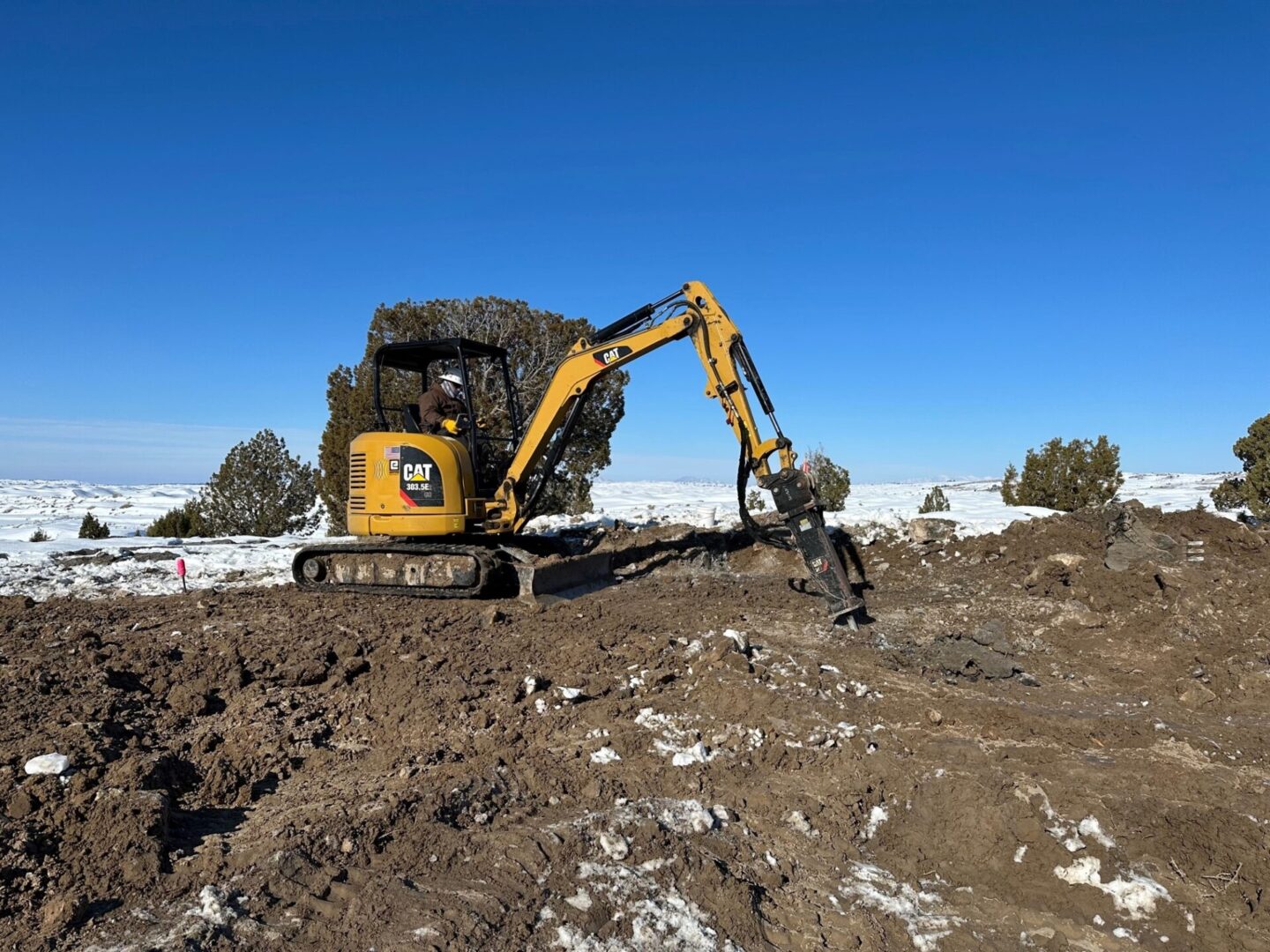 A yellow and black tractor is on the ground